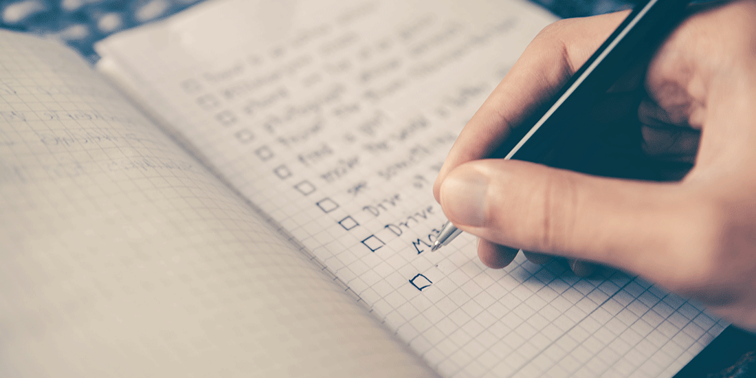 blog header: person writing a checklist