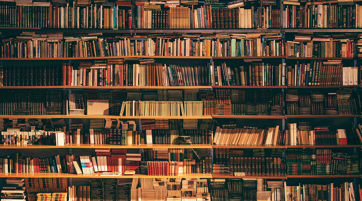 View of a bookshelf stacked full of books