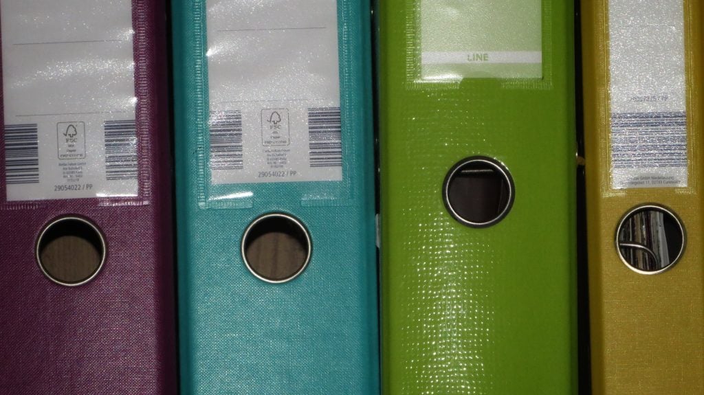 Folders end to end on a shelf