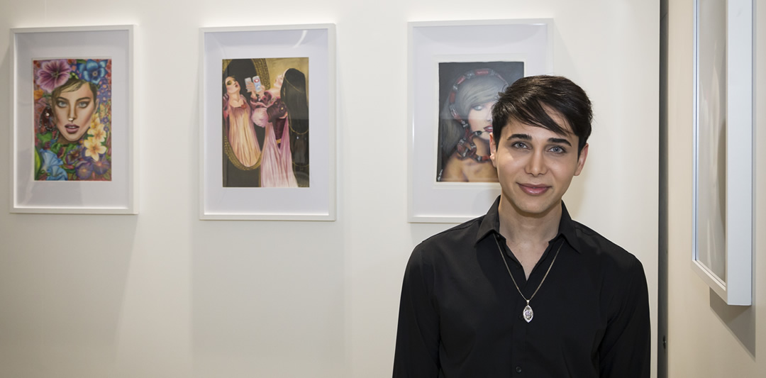 Alex in front of his artwork