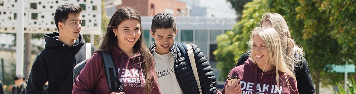 Students walking in DUSA hoodies