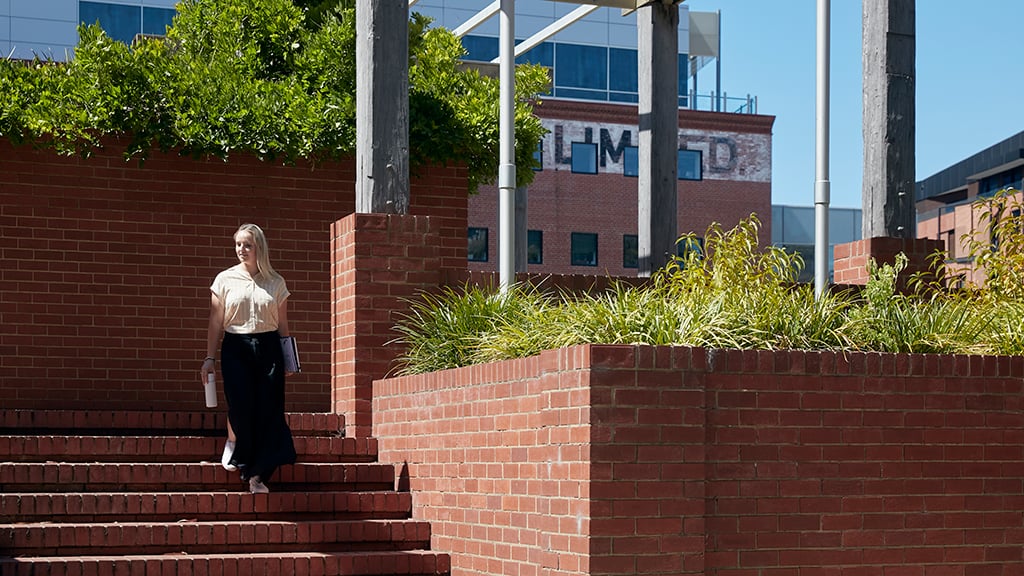 Female student walking at Geelong Waterfront Campus