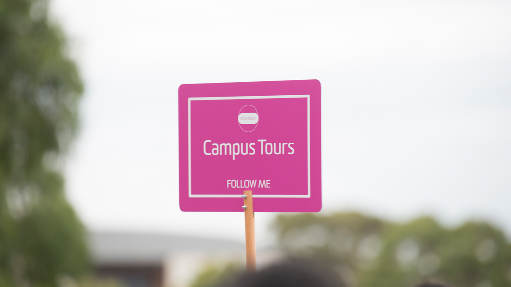 Pink campus tour placard