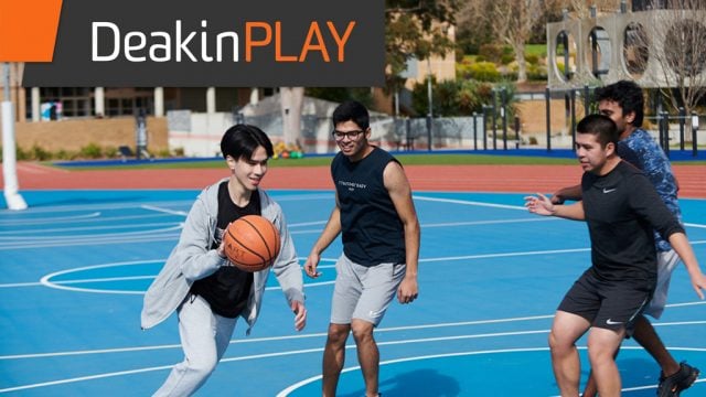 Four students playing basketball outside at Waurn Ponds Campus with DeakinPLAY branding imposed on image