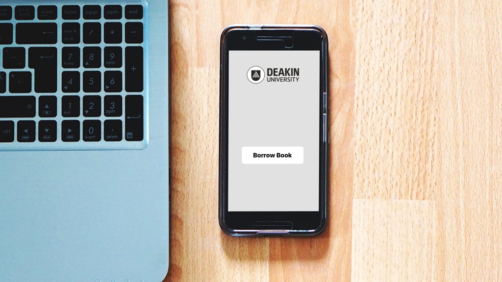 Laptop and mobile phone displaying DeakinBorrow app