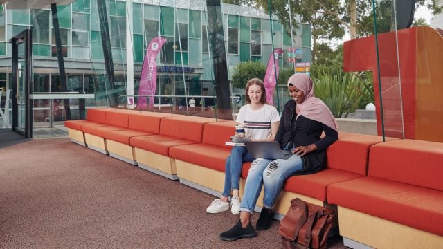 Two students sitting together at Burwood Campus