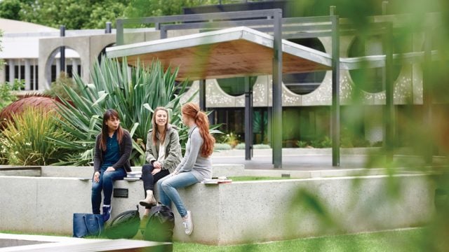 Three students sitting outside at Waurn Ponds Campus