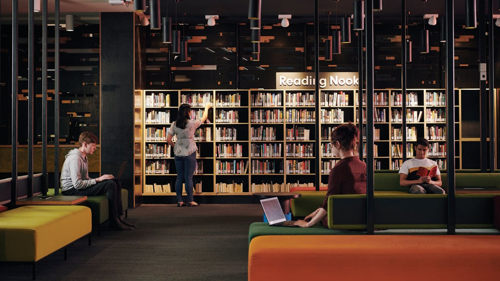 Students browsing and working in the Burwood library