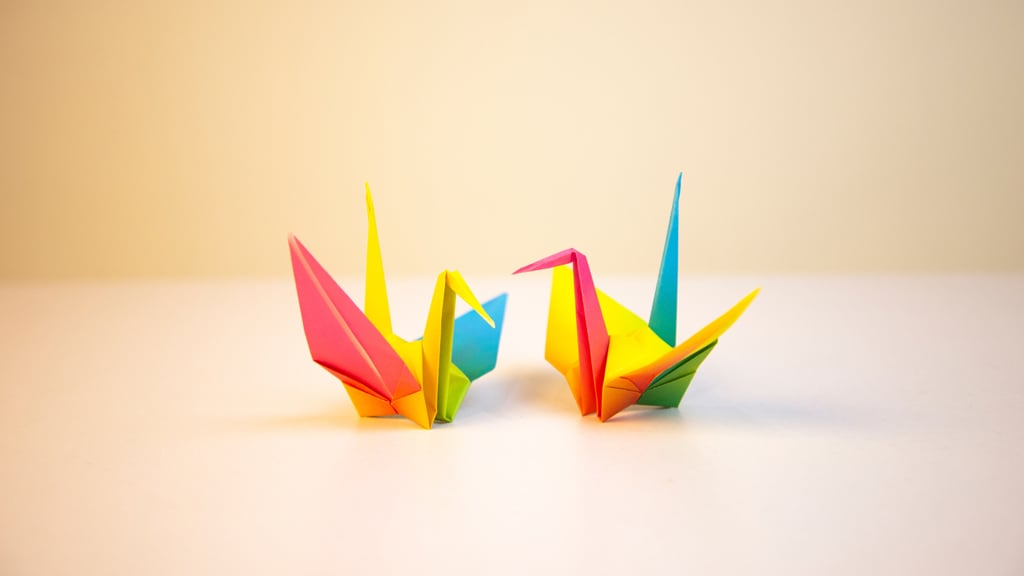 Two colourful origami cranes