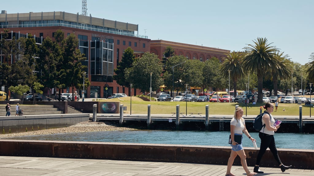 Students walking on pier outside Waterfront Campus