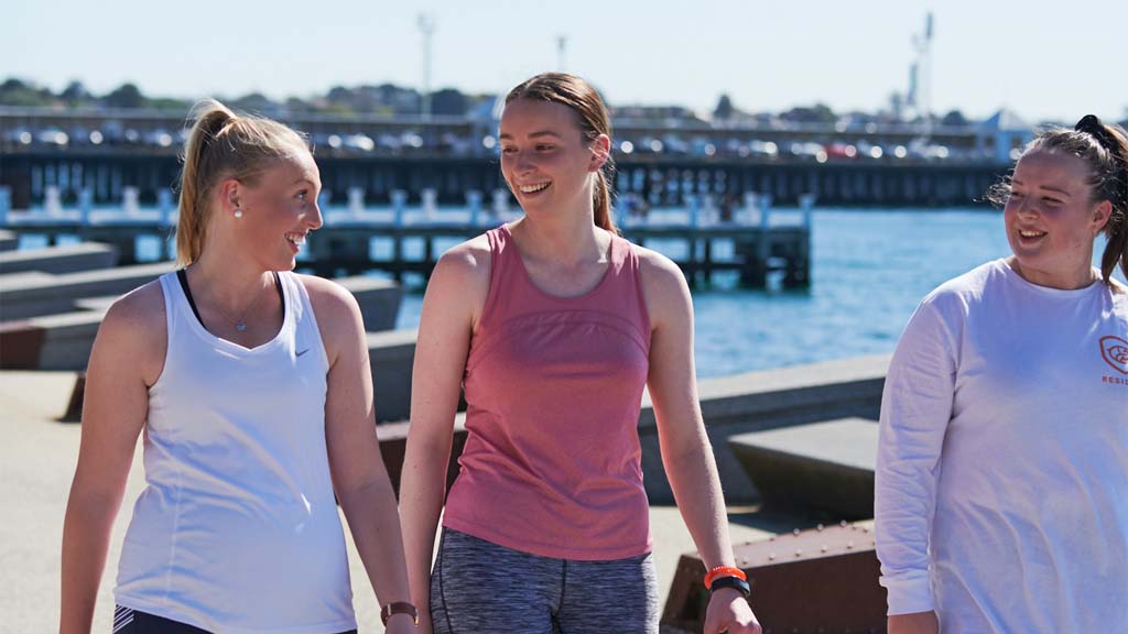 Three women walking together at Geelong Waterfront