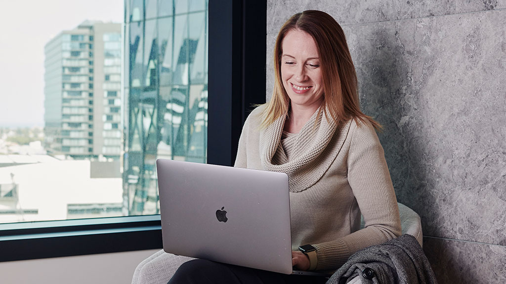 Smiling female with laptop