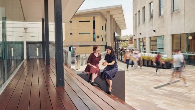 Two students chatting outside at Burwood Campus