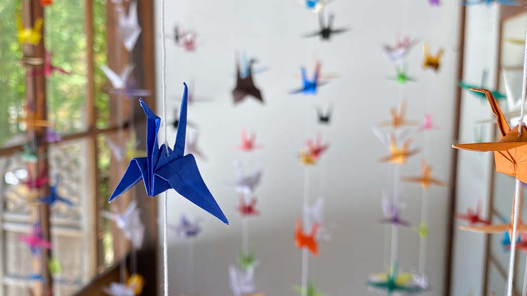 Origami cranes hanging from ceiling