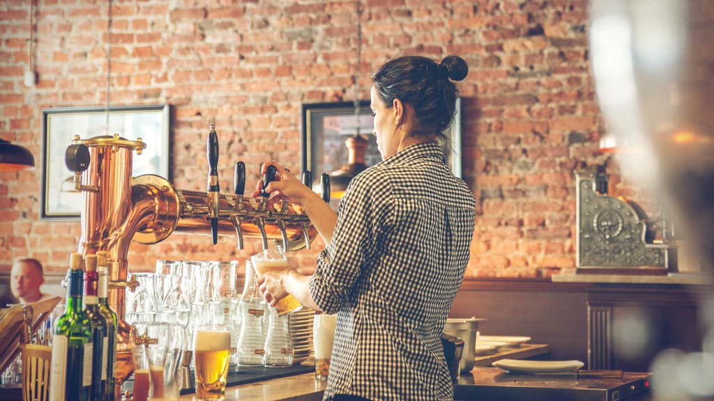 Bartender dispensing a beer