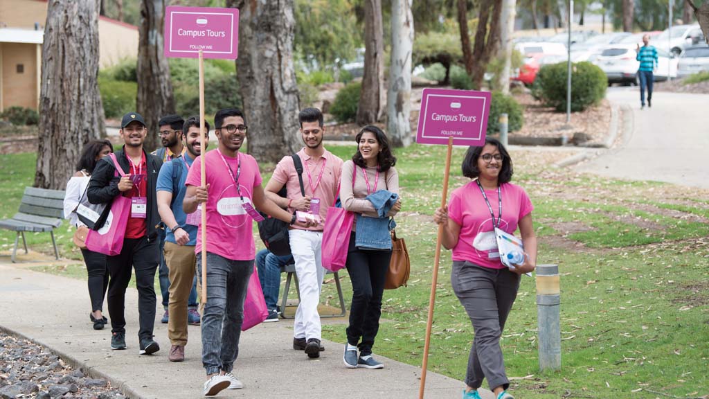 A group of Orientation Ambassadors take new students on a campus tour around Waurn Ponds