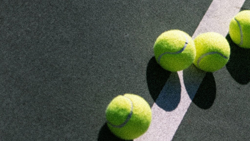 Tennis balls on court