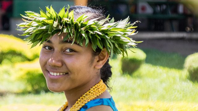 Smiling Fijian woman wearing headdress
