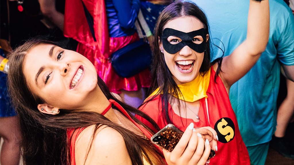 Two students in costumes at a DUSA event