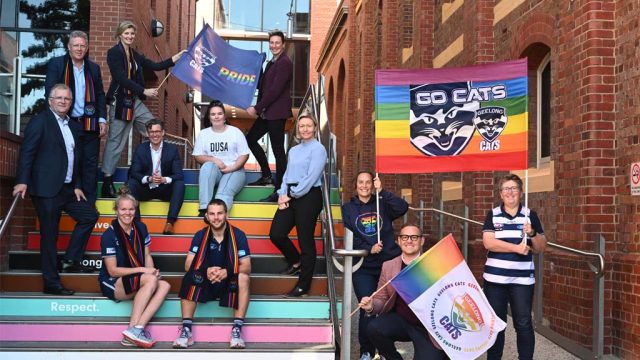 Deakin students and staff on the Pride Stairs at Waterfront Campus