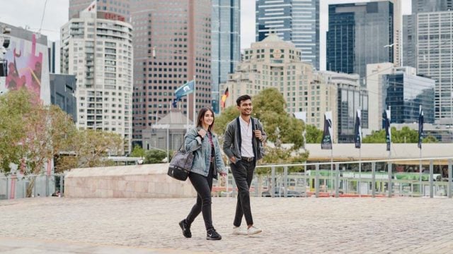 Two students walking through Melbourne CBD