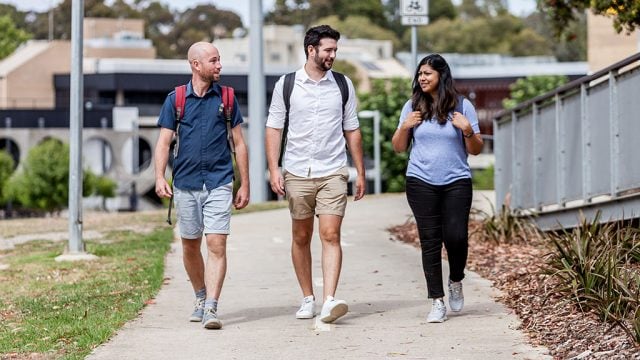 Three students walking on Waurn Ponds Campus