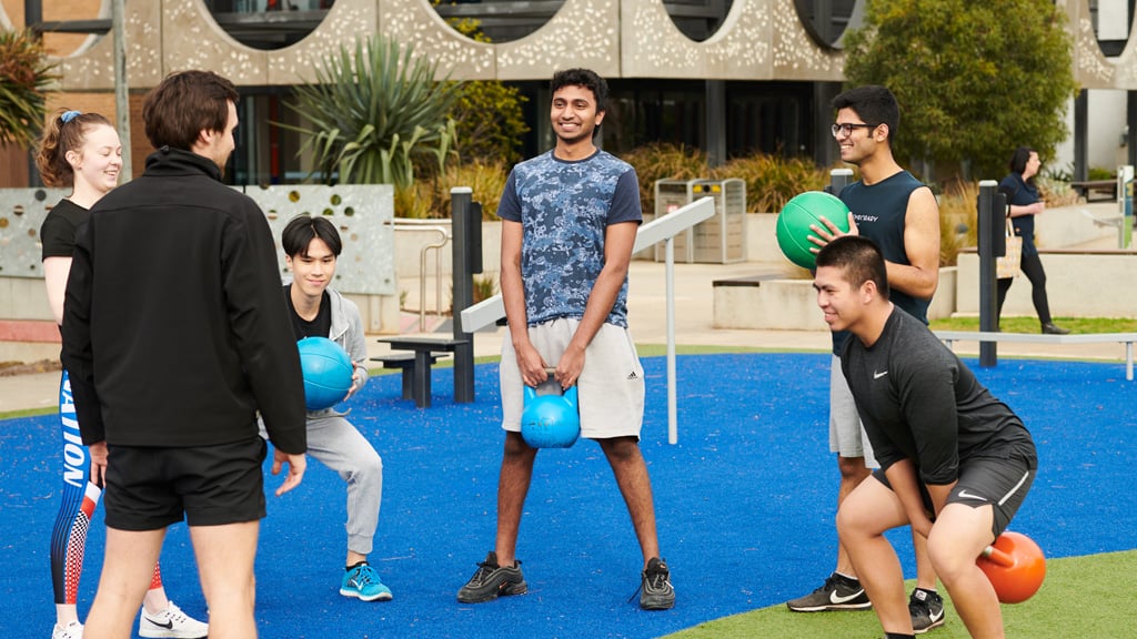 Students enjoying a group fitness class outside at Waurn Ponds Campus