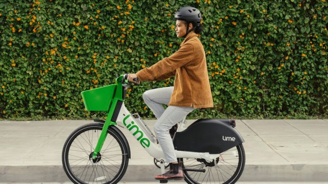 Woman riding a Lime e-bike
