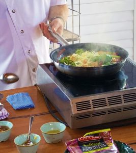 Adam Draper cooking stir-fry