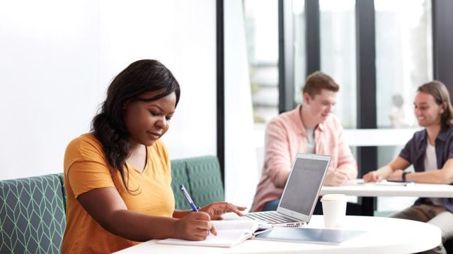 Student working in communal area at Burwood Campus