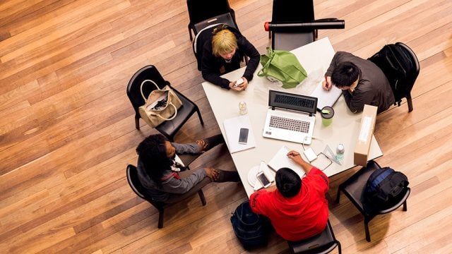 Aerial view of a group of students working in common space at Burwood