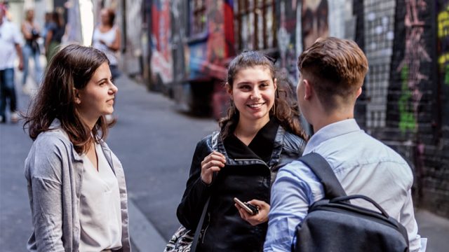 Students chatting in Hosier Lane, Melbourne