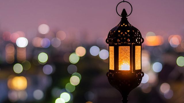 Hanging lantern with night sky and city bokeh light background