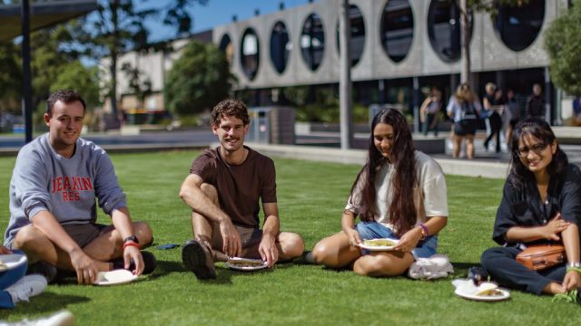 Res students sitting on Union Green lawn at Waurn Ponds Campus