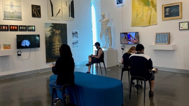 Students sketching inside the Deakin University Art Gallery at Burwood Campus