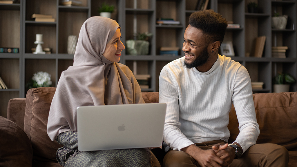 two international student smiling at each other