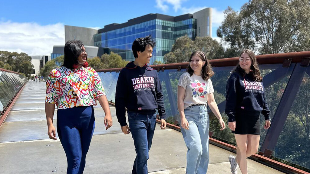 DUSA representatives cross the footbridge at Burwood Campus