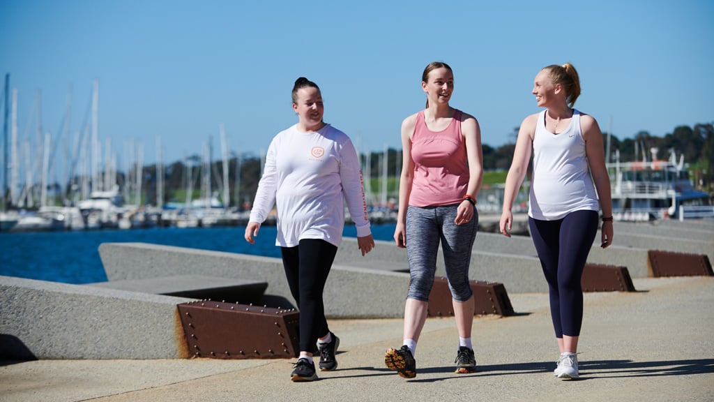 Three students walking together at Geelong Waterfront precinct