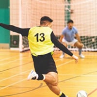 Man playing indoor futsal