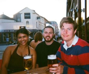 Deakin Abroad student Keegan (centre) with university friends at a pub in Exeter