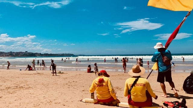 Surf lifesavers patrol an Australian beach