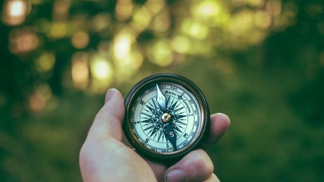 Person holding compass