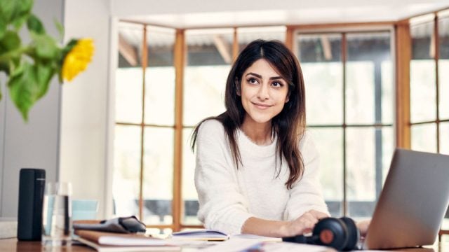 Student working on desk at home