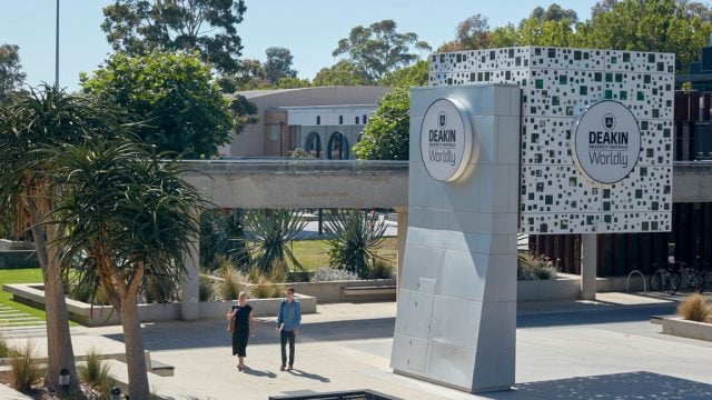 Students walking near cube at Waurn Ponds