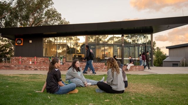 Res students sitting on the lawn at Waurn Ponds Campus