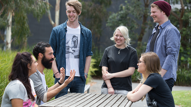 group of students smiling and talking