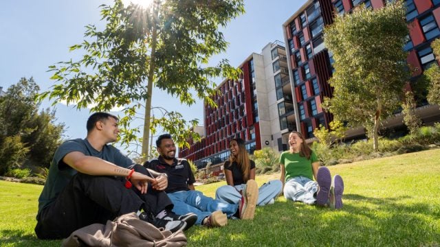 Deakin Res students sitting on the lawn at Burwood Campus