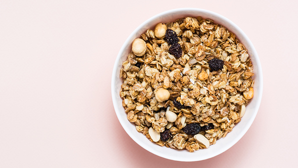 Bowl of granola with nuts and berries.