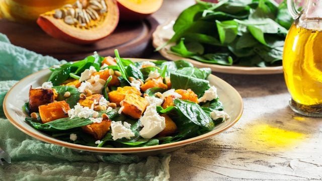 Plate of salad with roast pumpkin, rocket and feta.