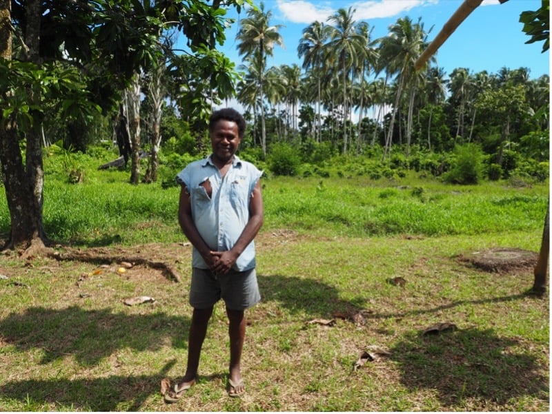 Picture of a man in a field in Papua New Guinea
